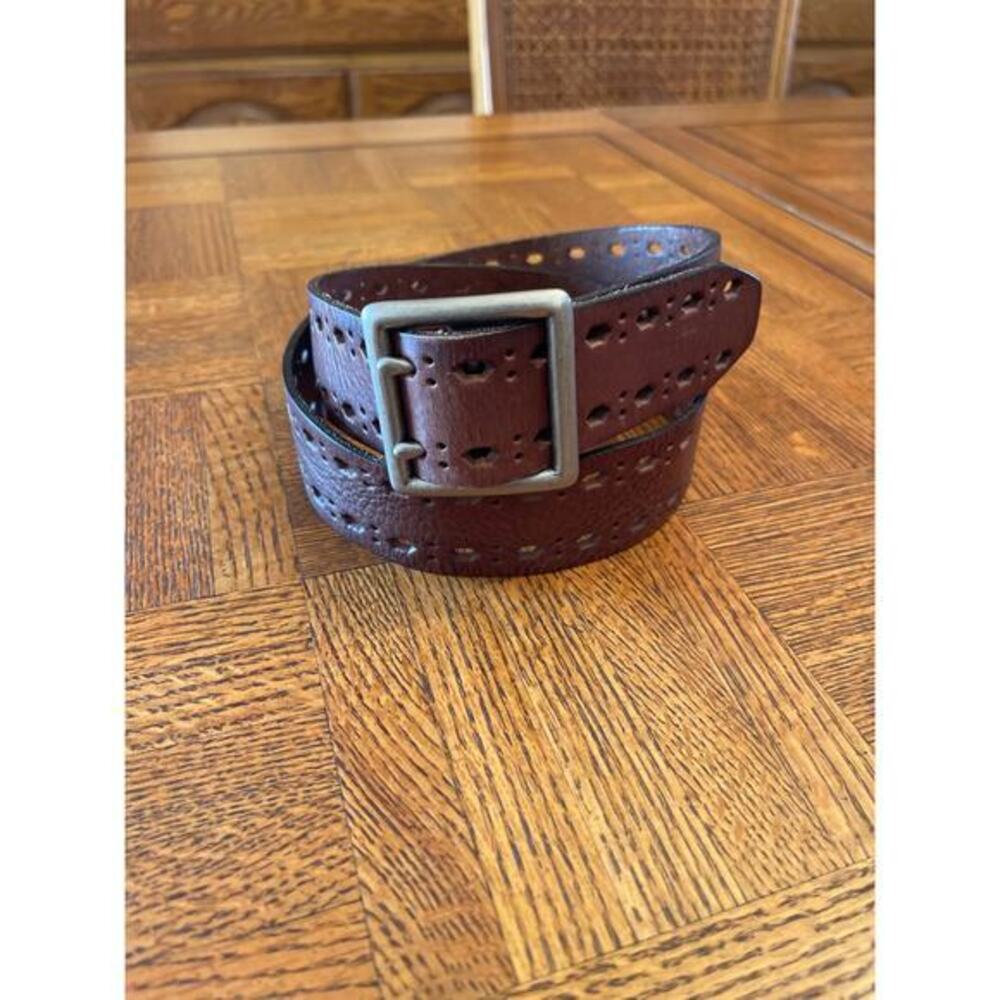 Leather laser cut belt with a brass buckle